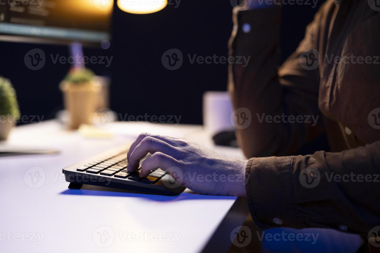 Cybersecurity specialist using computer to look for company security vulnerabilities and prevent malware infections. Programmer installing fortified code on PC to prevent cyberattacks, close up shot photo