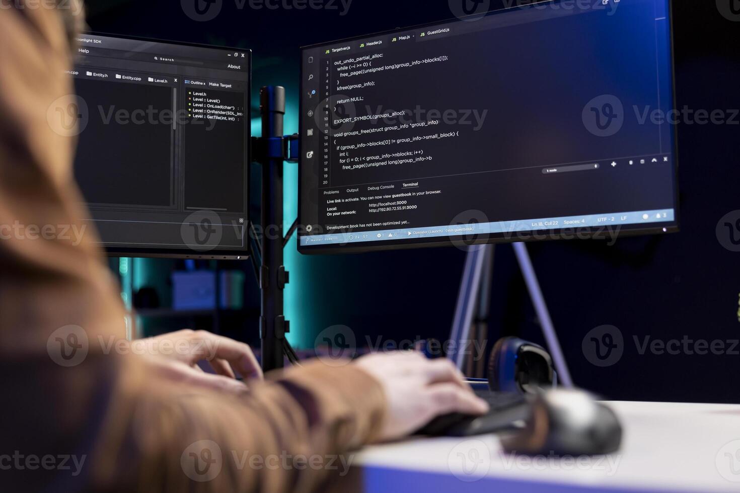 Teleworking cybersecurity administrator using computer to look for security vulnerabilities. IT technician typing on keyboard, installing safeguard code on PC to prevent cyber attacks, close up photo