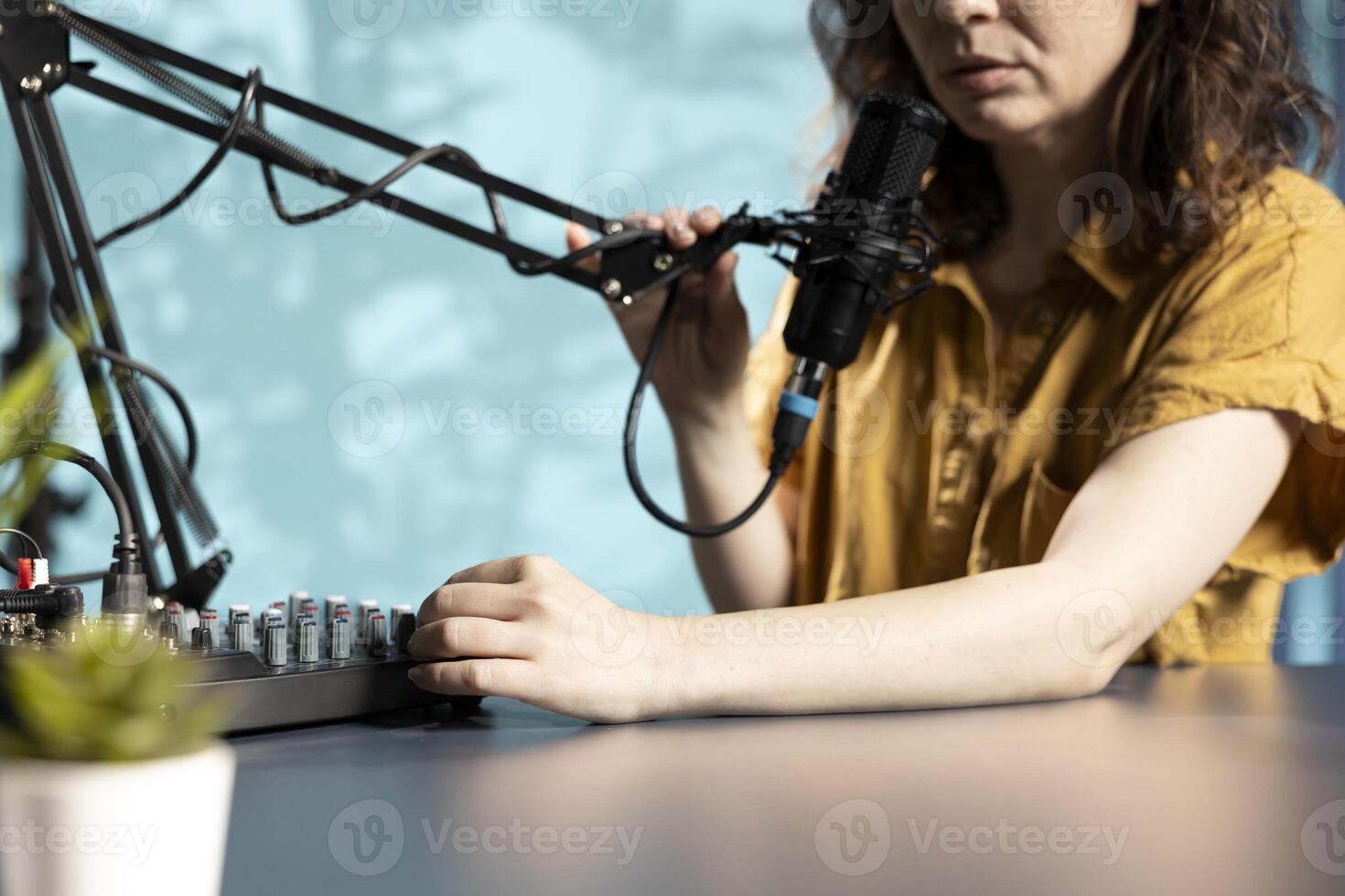 Tech guru filming technology review of newly released DJ controller, unboxing it and presenting specifications to audience. Influencer showing sound mixer equipment to followers, close up shot photo