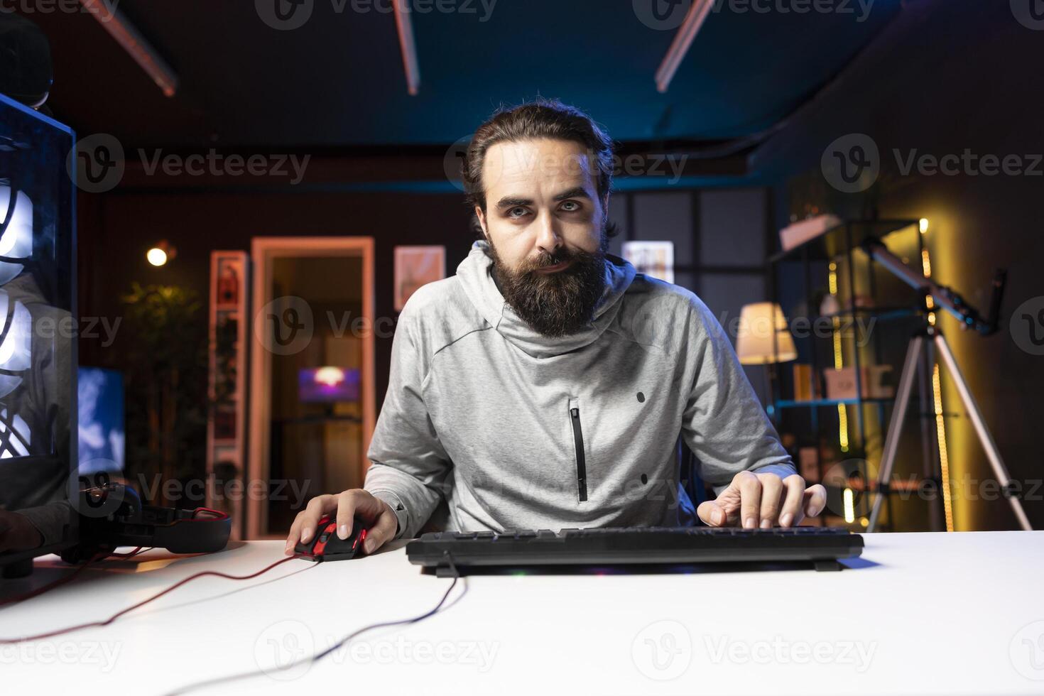 Man using gaming mouse and keyboard to play entertaining videogame, moving character. Pro gamer using professional computer peripherals to enjoy relaxing game at home, having fun photo