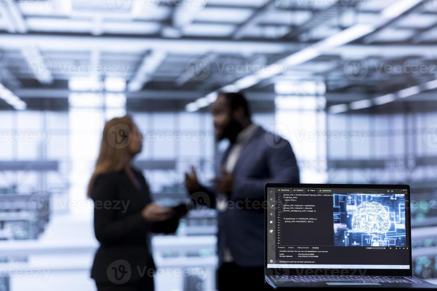 Focus on AI software on laptop in front of coworkers programming in AI data center. Close up of notebook in Server hub used by workers upgrading artificial intelligence systems photo