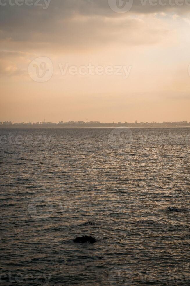 The sea, the horizon is visible. Warm weather, a breeze at sea. photo