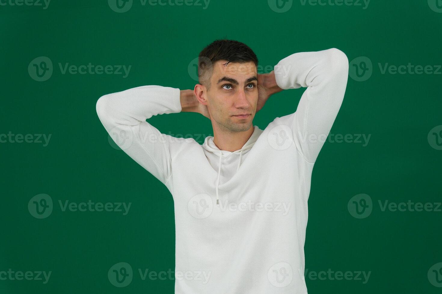 Studio portrait of a man thinking photo