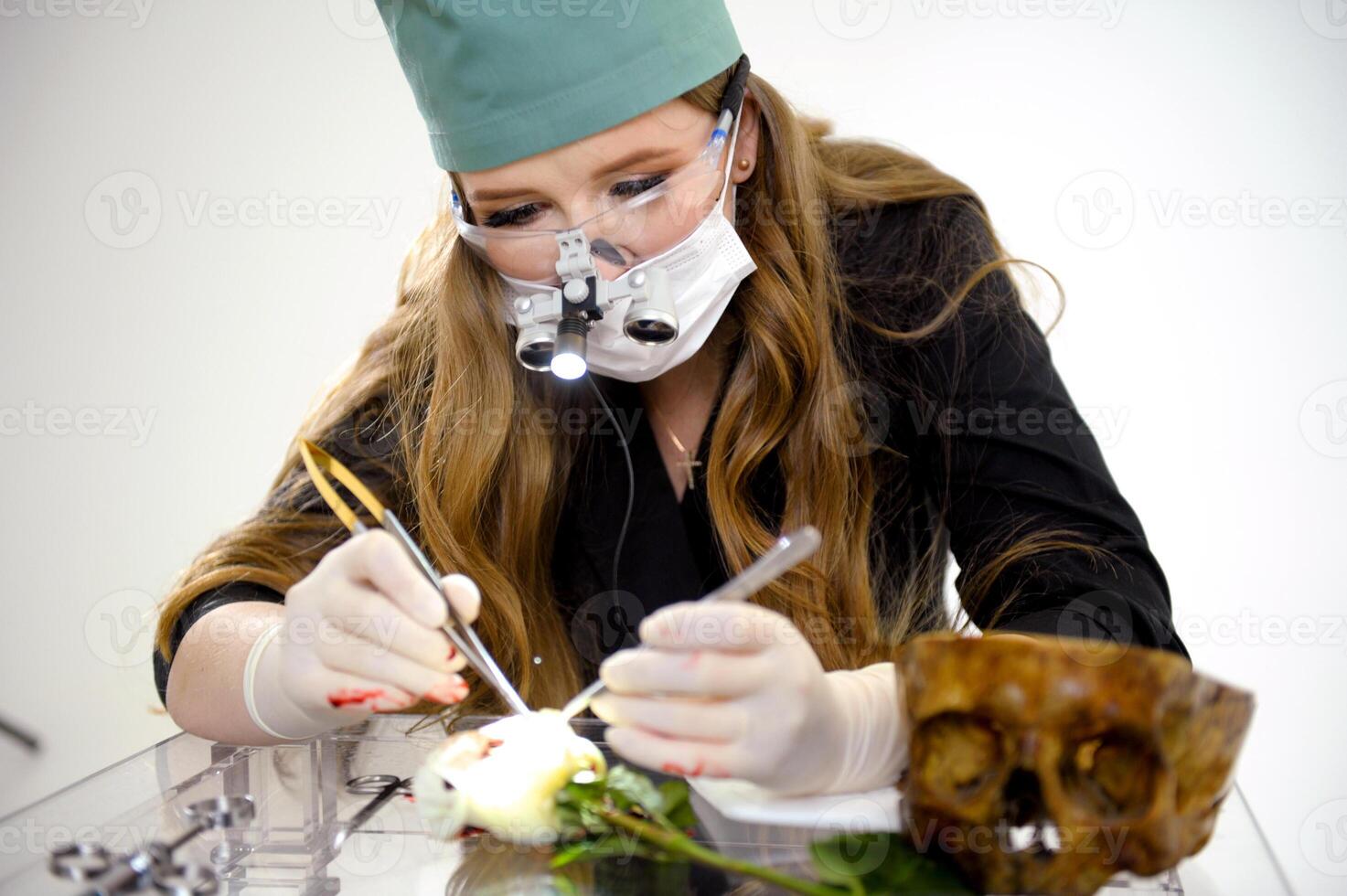 Selective focus on surgical needle holder with blur background.Surgeon or doctor inside operating room did suture while surgery in hospital.Orthopedic or cosmetic and surgical emergency surgery. photo
