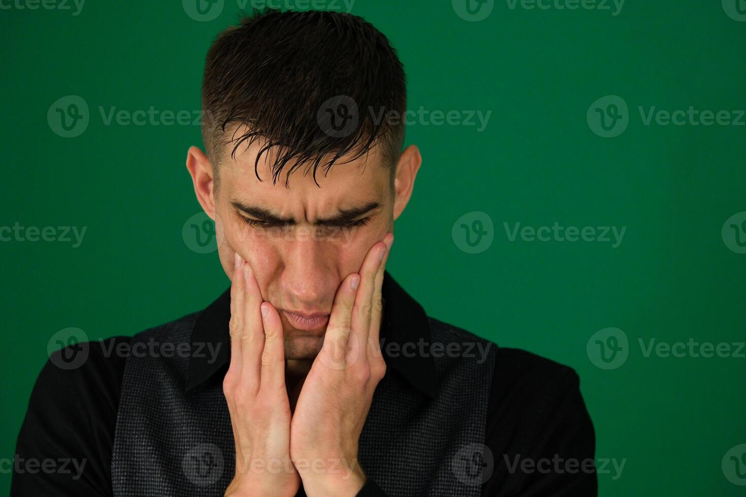 A young man expressing frustration , showcasing emotions during a challenging moment photo