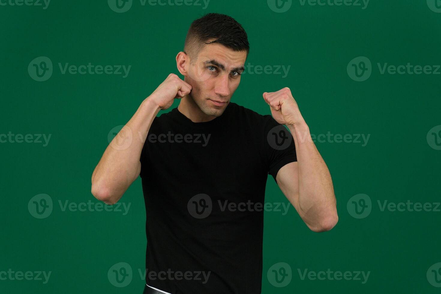 Young blond man wearing casual sweater Ready to fight with fist defense gesture, angry and upset face, afraid of problem photo