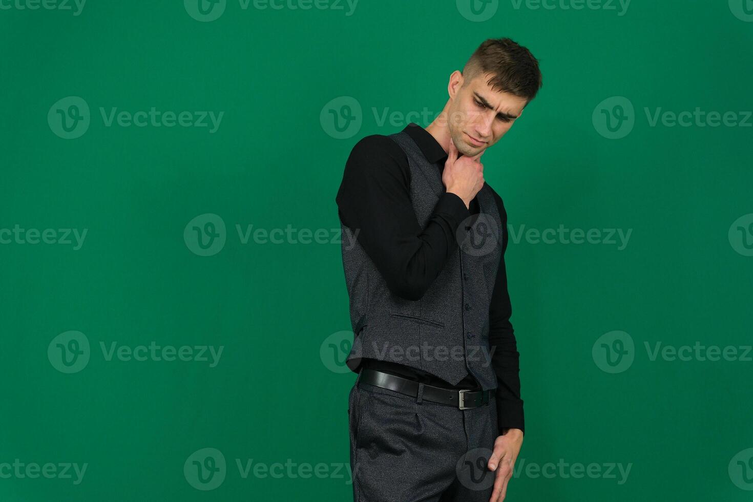 young handsome hicpanic man thinking, feeling doubtful and confused, with different options, wondering which decision to make photo