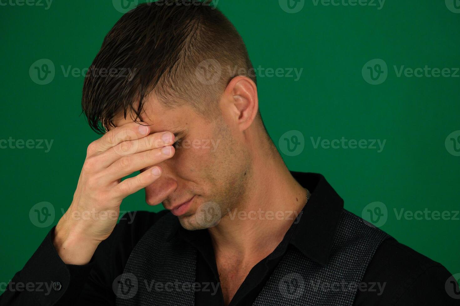 Asian young man wearing white shirt with sad expression covering face with hands while crying. depression concept over white background photo