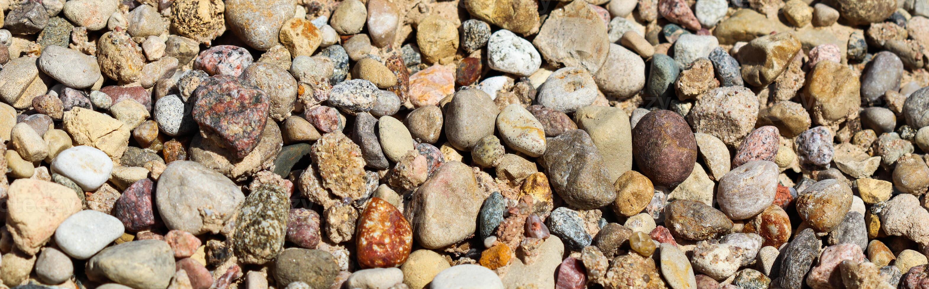 Various gravel pile for background. Sharp closeup stones for construction. Rubble texture photo