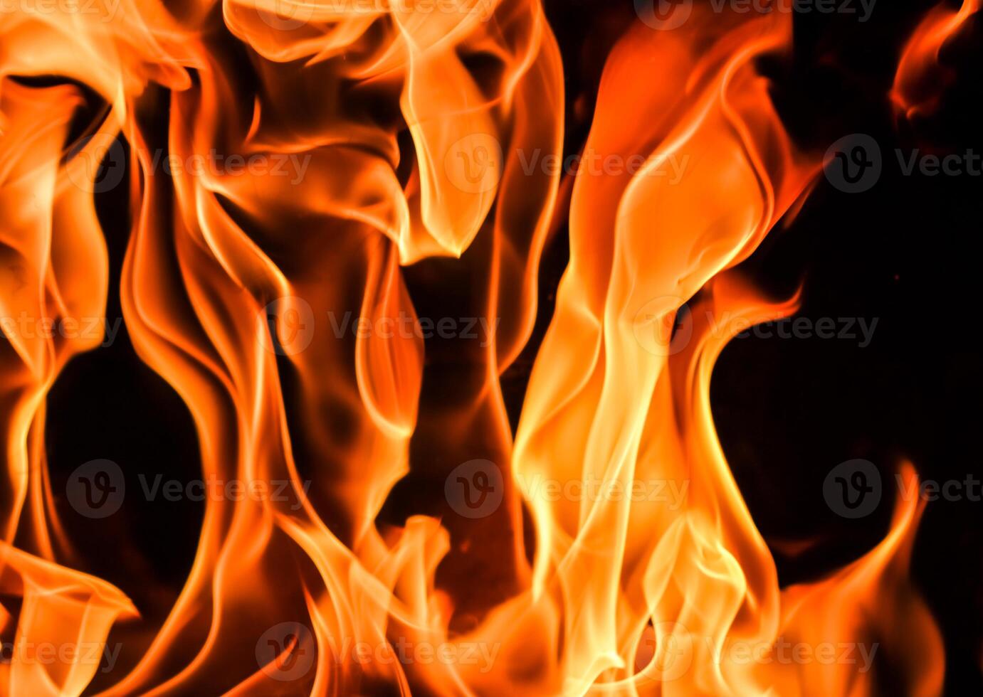 Flames of fire on a black background. The mystery of fire. photo