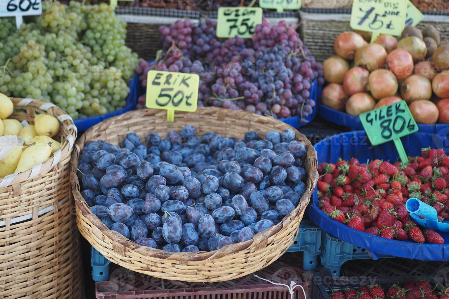 A Colorful Variety of Fresh Fruits Delightfully Displayed at Market Stall photo