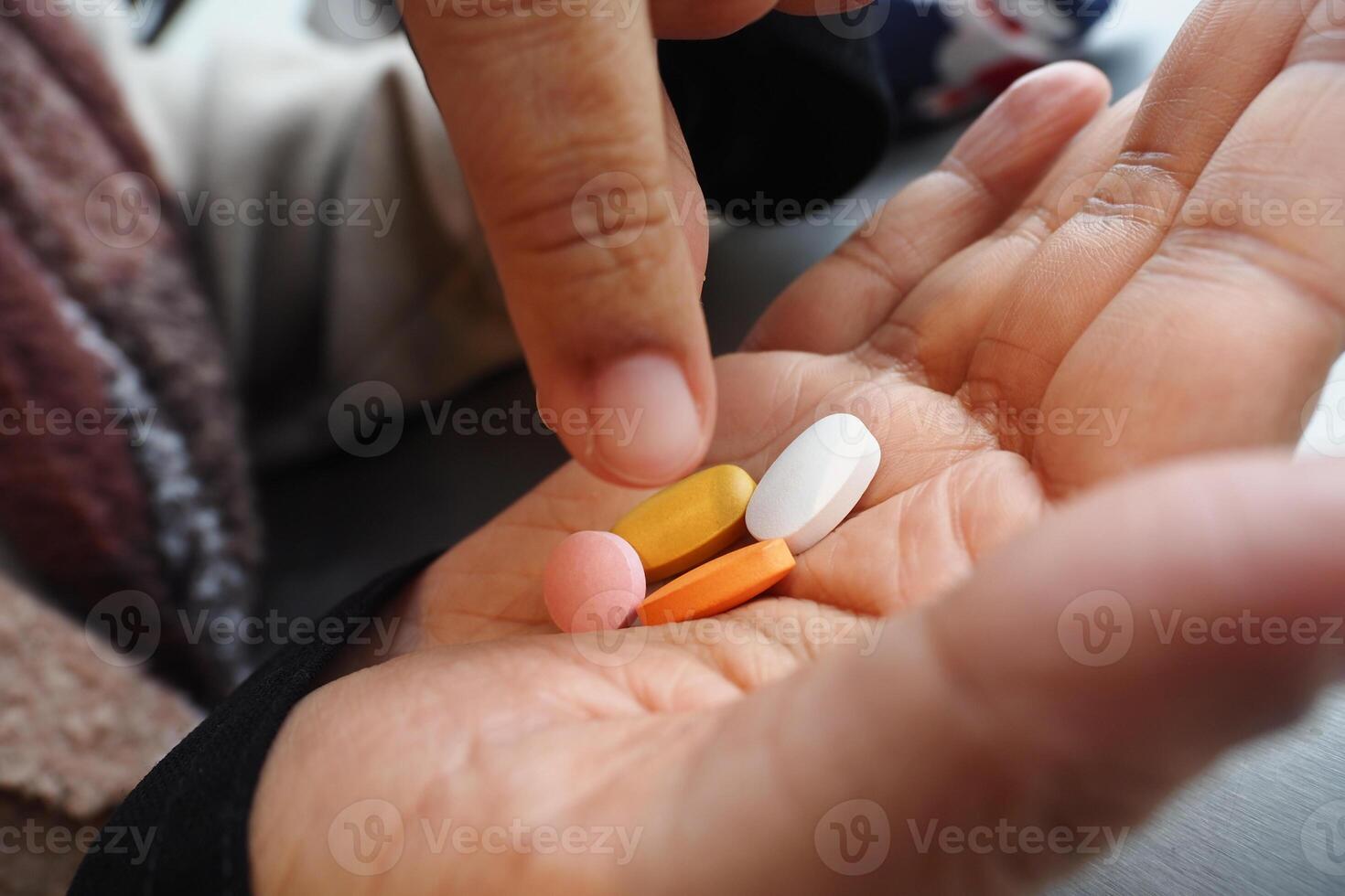 A Wide Range of Various Medications Held Comfortably in One Hand photo