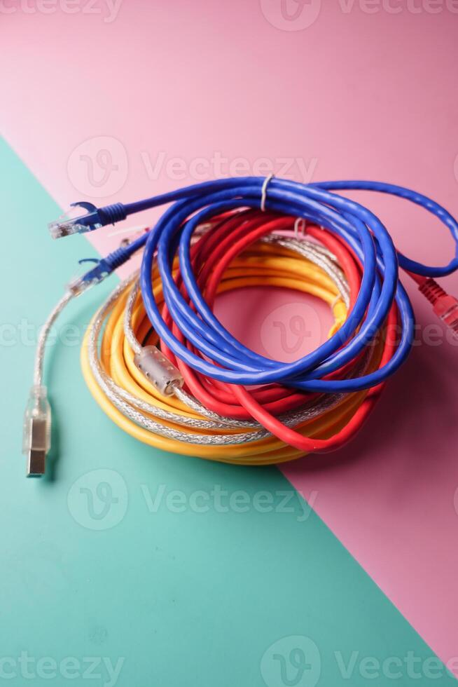 Stack of colorful elastic rubber bands on table photo
