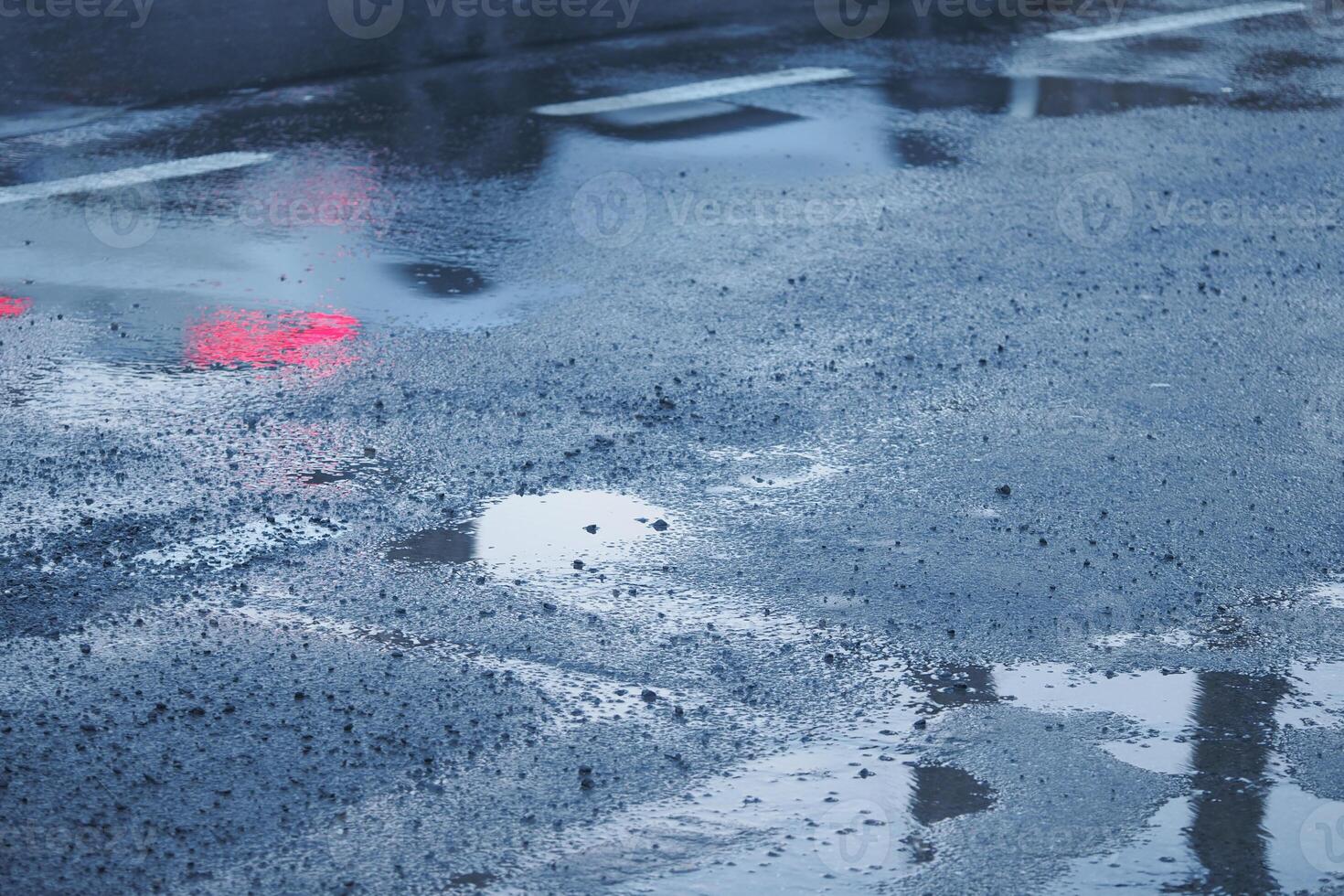 Reflections observed on the wet pavement after a rain shower has ended photo