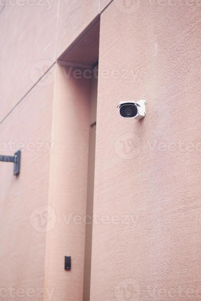 Security Camera Successfully Mounted on the Wall for Optimal Surveillance Purpose and Use photo