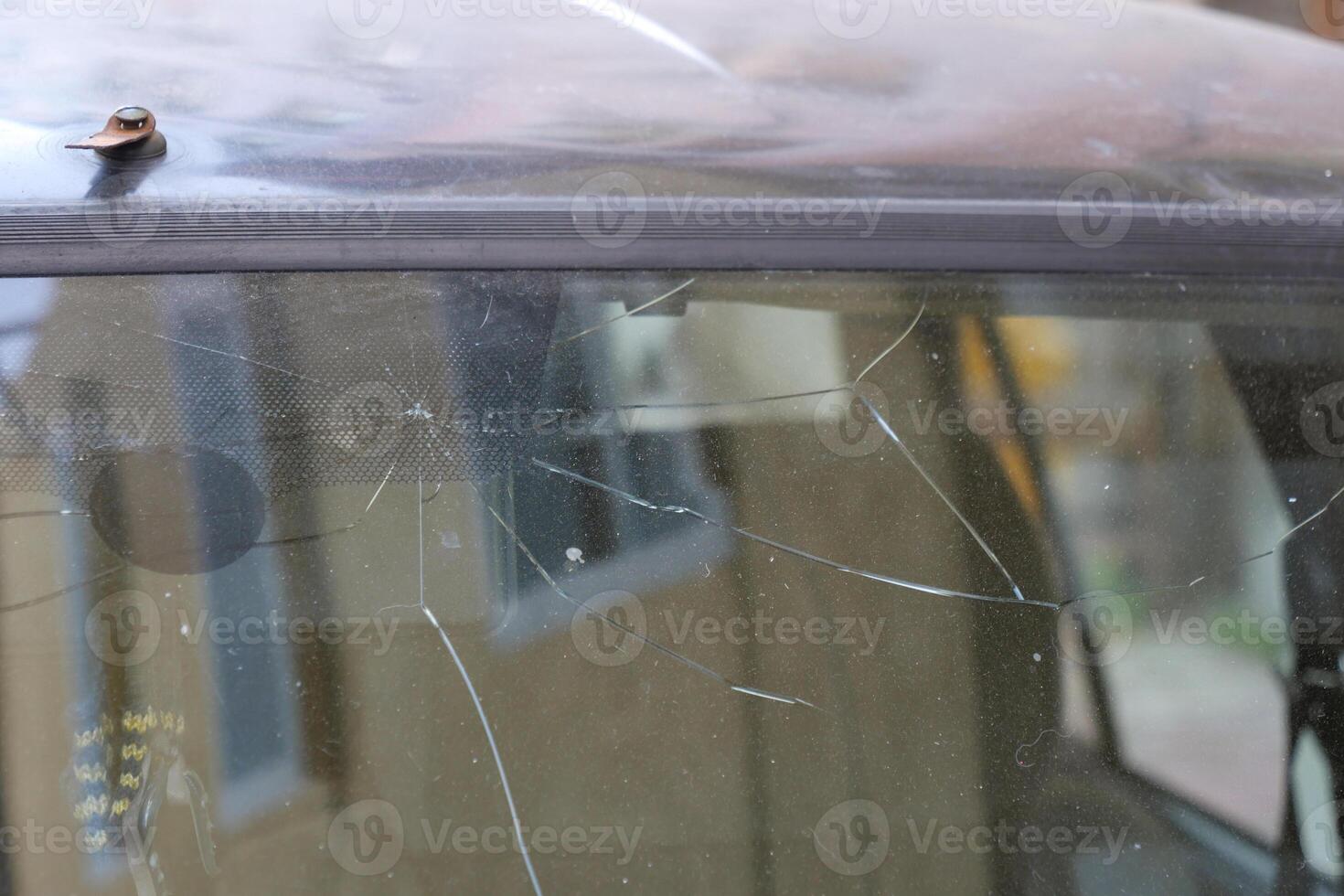 A CloseUp Image Featuring a Scratched Car Window with Detailed Elements photo