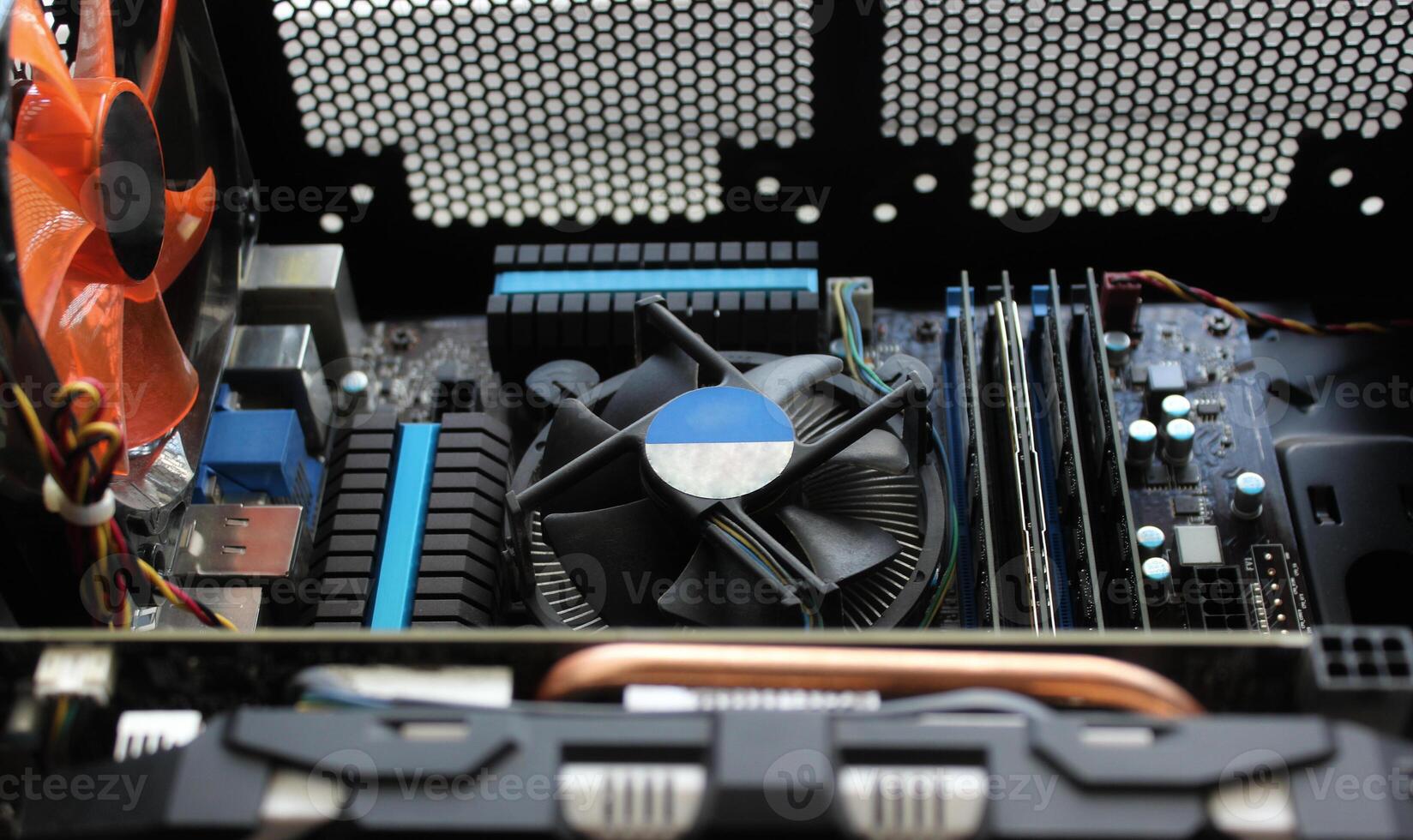 System unit of a powerful desktop computer with the cover removed. Computer hardware connection and mounting stock image photo