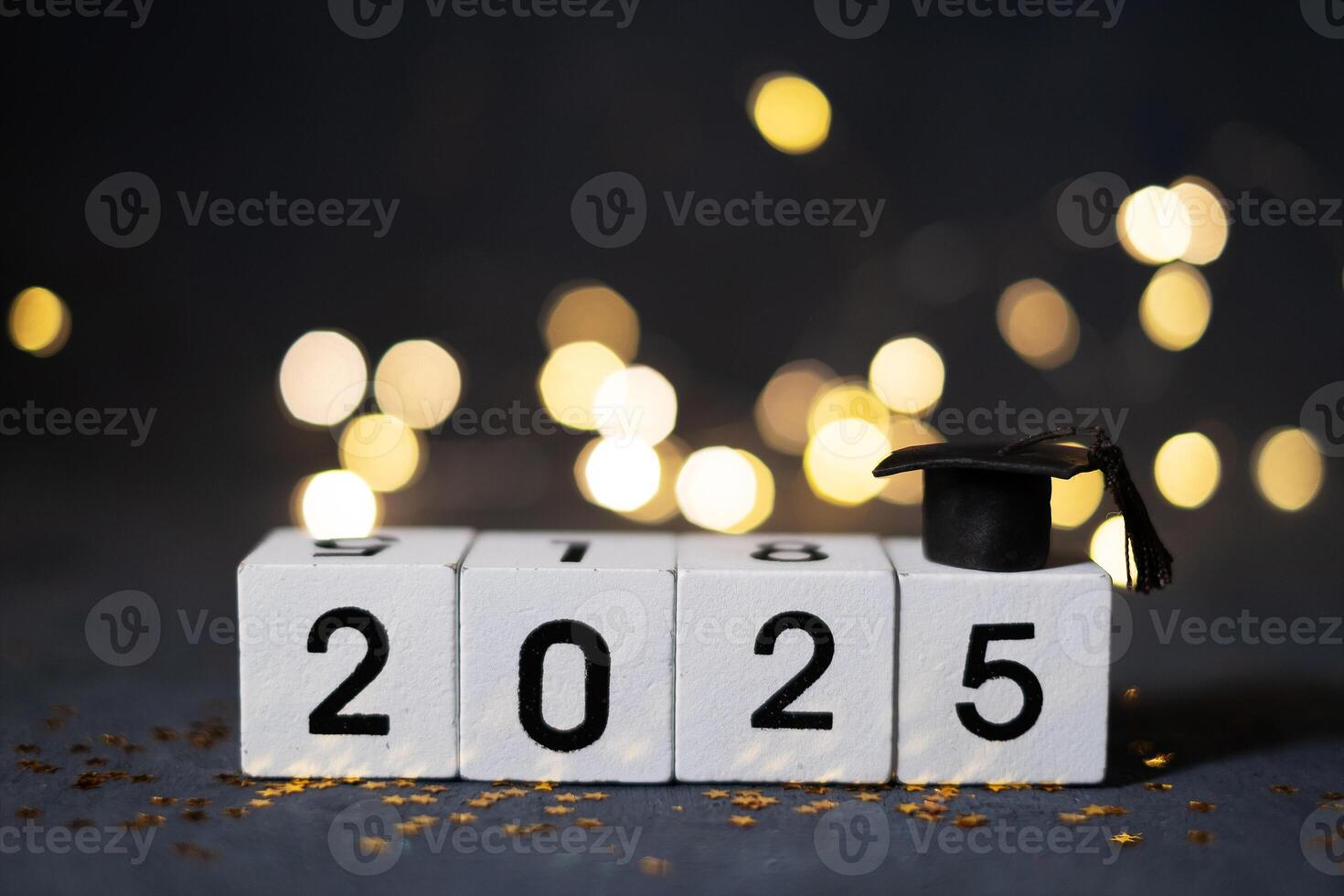 2025 New Year's wooden cubes with a graduate's cap. Class of 2025 concept photo