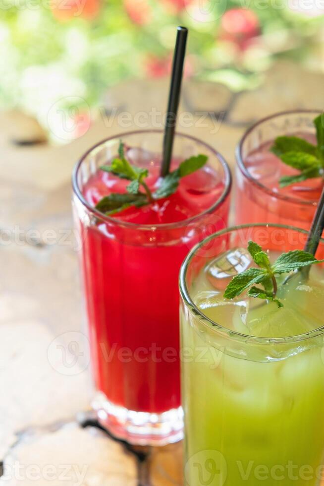 Close up colored summer lemonades with ice and mint. Summer drinks. photo
