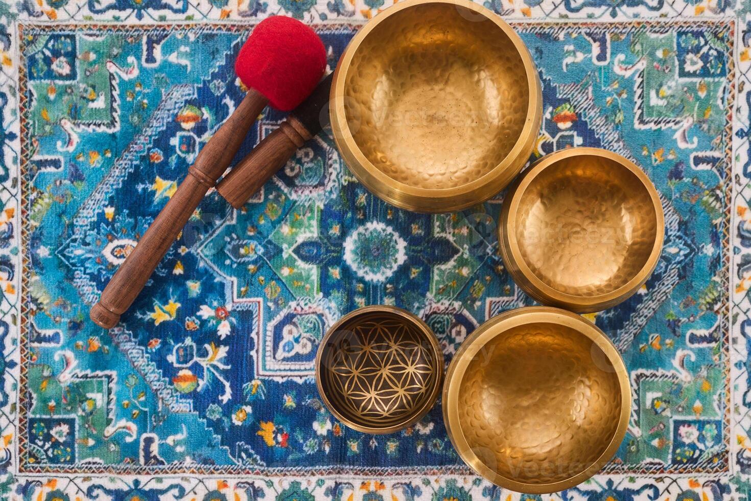 Singing Bowls on Patterned Carpet photo