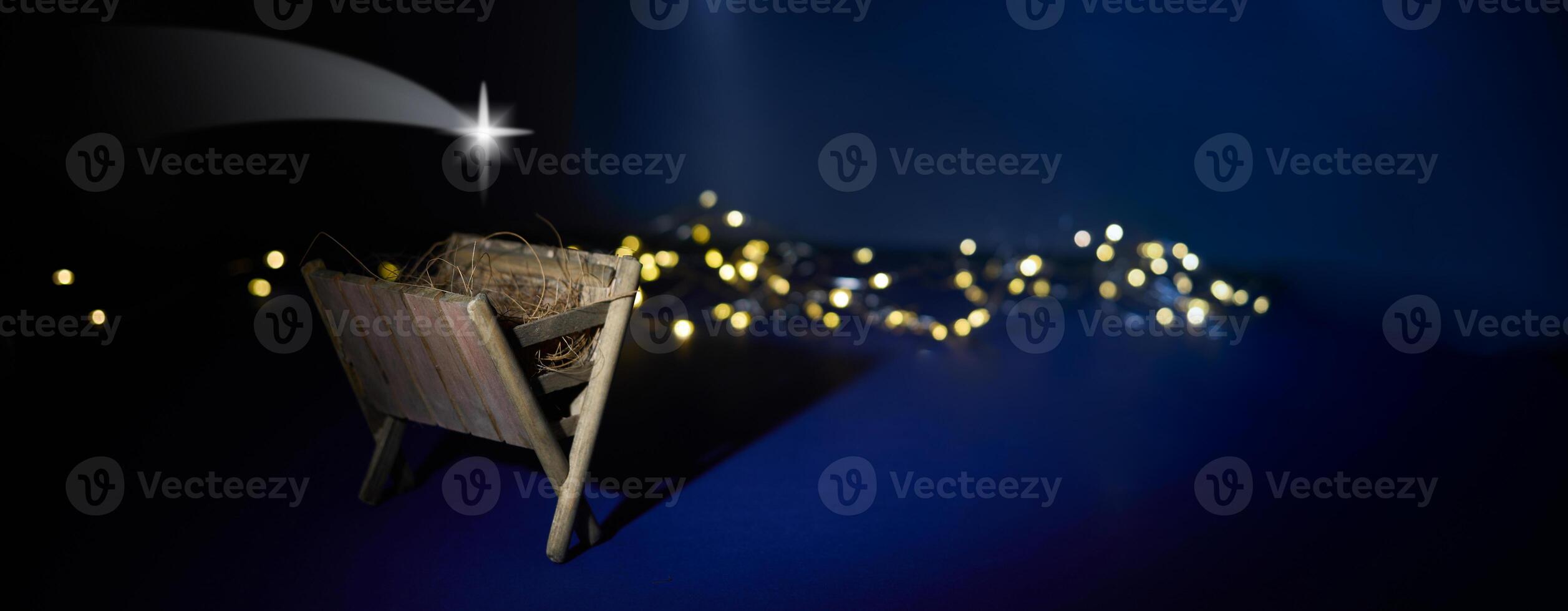Nativity Scene. A serene nativity scene with a star and fairy lights photo