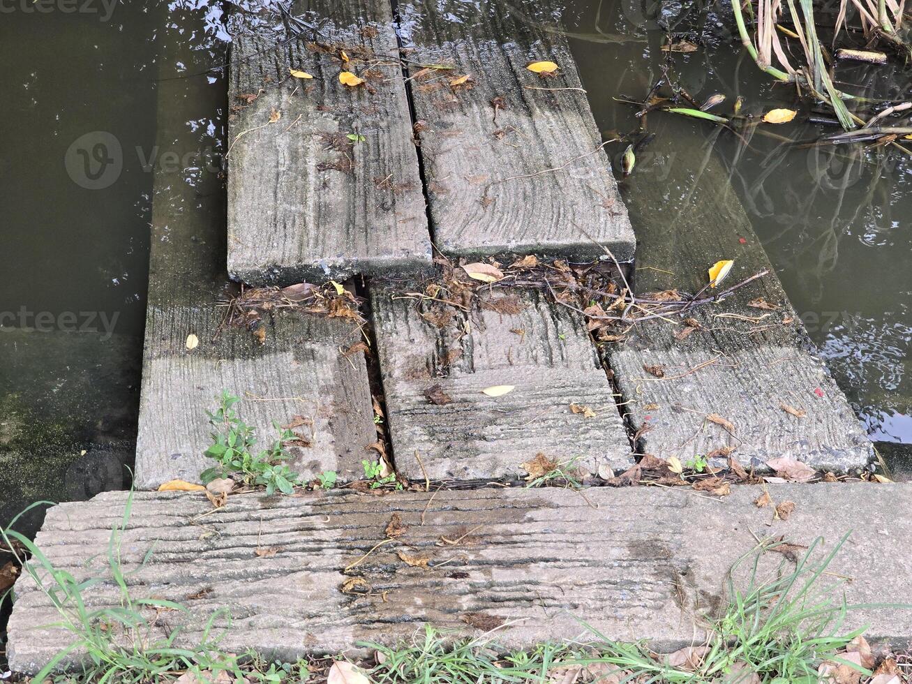 old cement bridge in the park photo