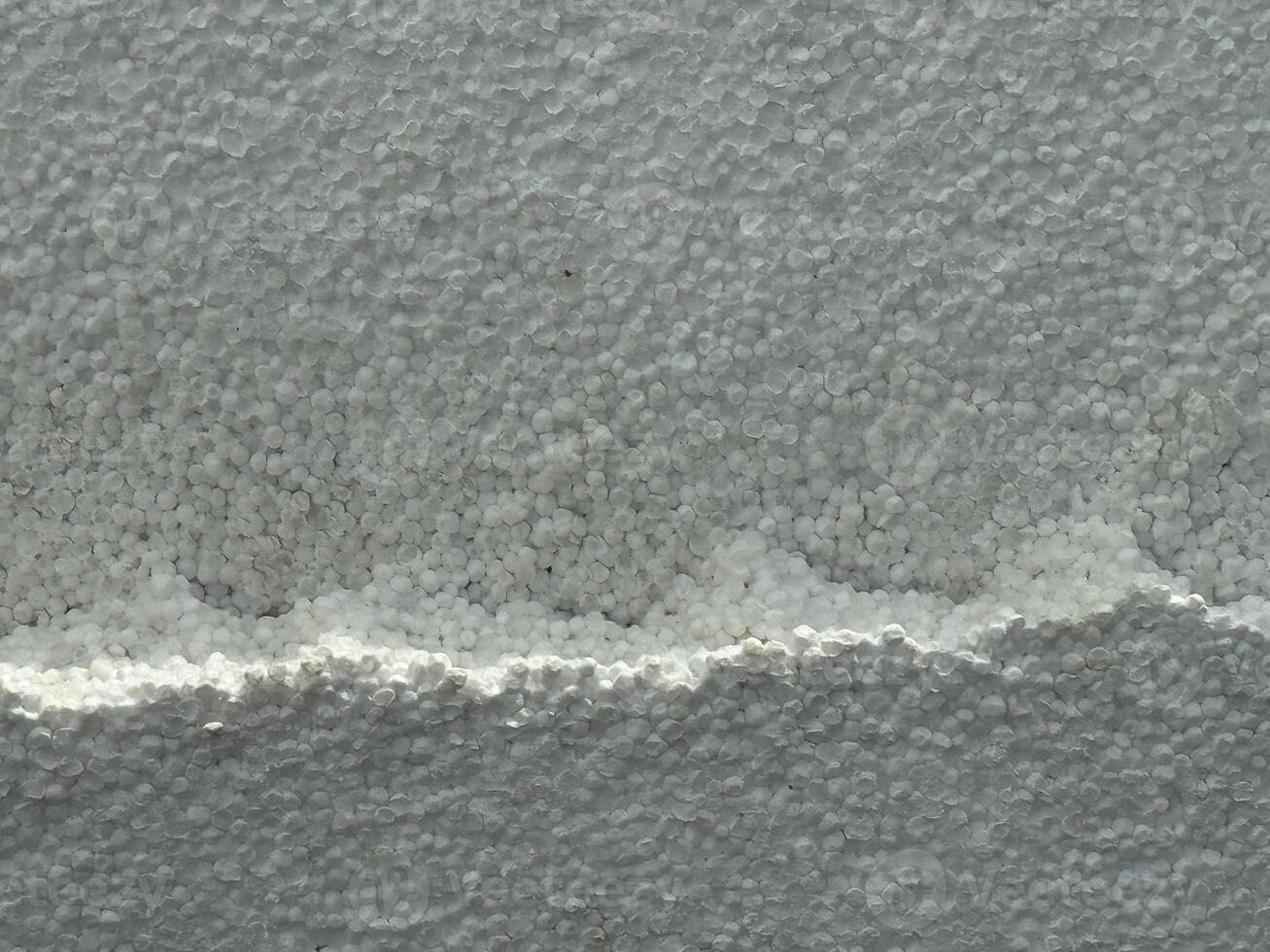 White foam board background. Styrofoam sheet texture backdrop. Expanded Polystyrene material packaging. photo