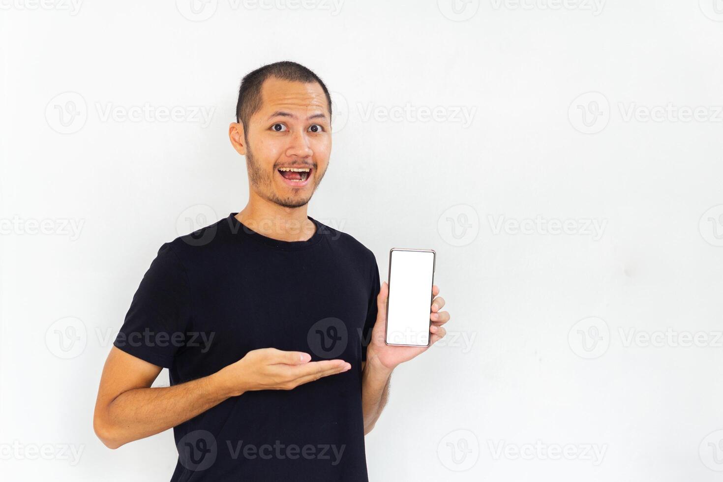Men showing blank screen smartphone with black empty shirt on isolated white background photo