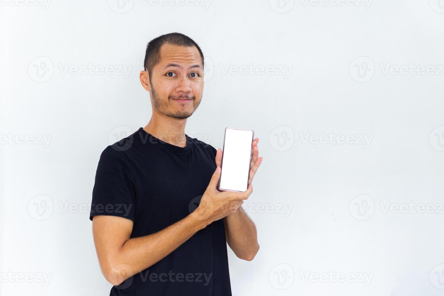 Men showing blank screen smartphone with black empty shirt on isolated white background photo