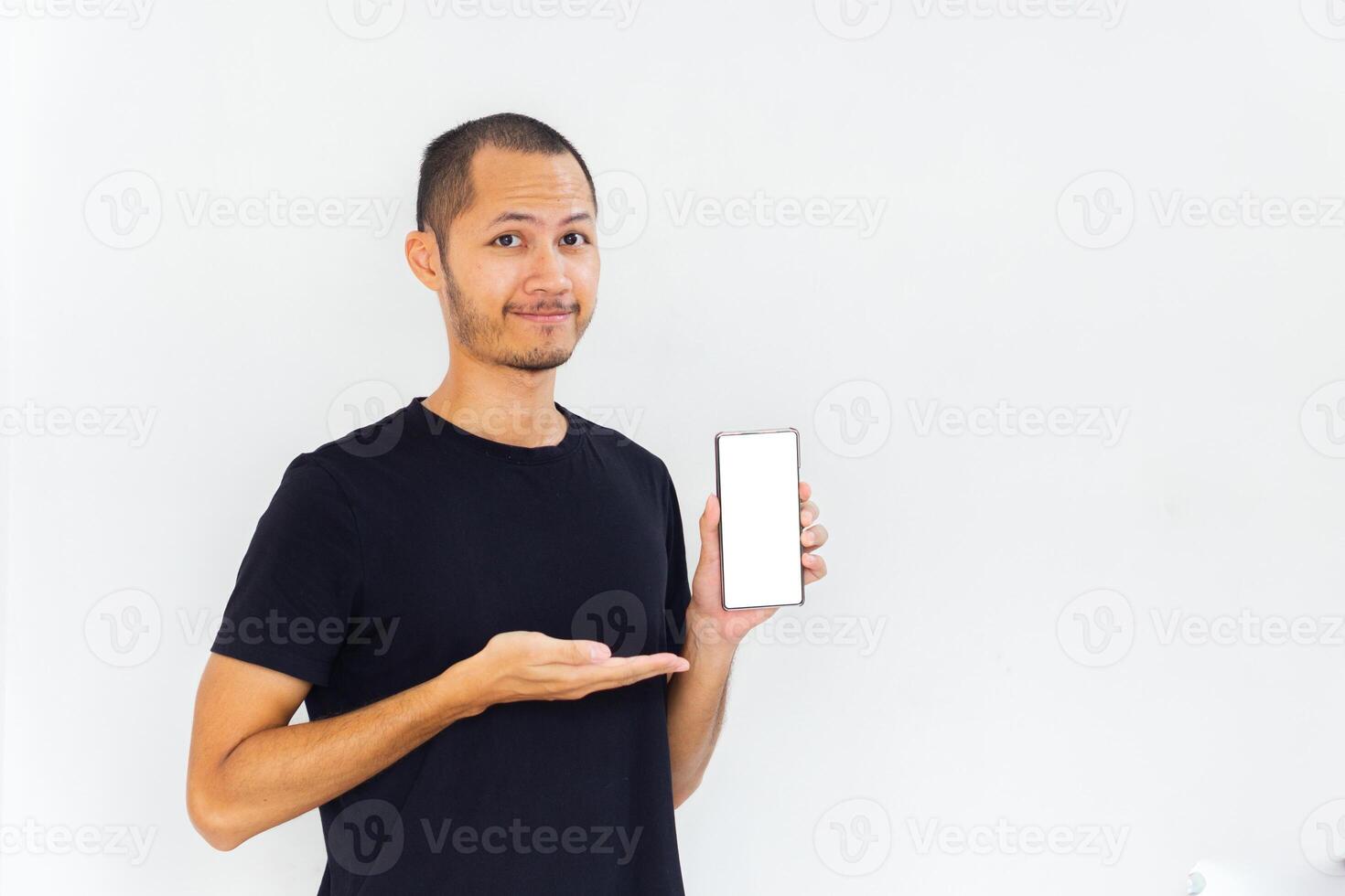 Men showing blank screen smartphone with black empty shirt on isolated white background photo