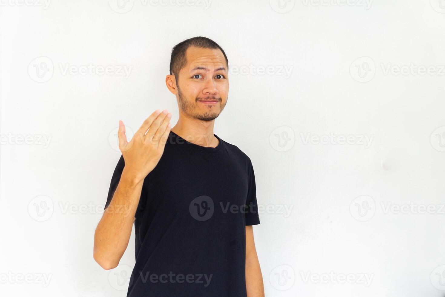 Young men with black empty shirt is inviting to come on isolated white background photo