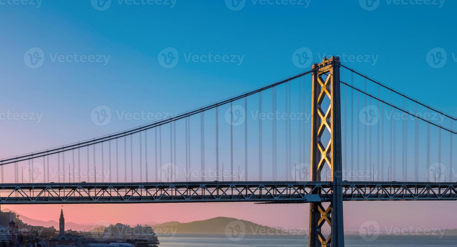 Cruise ship docked near panoramic San Francisco financial skyline near Oakland Bay Bridge photo