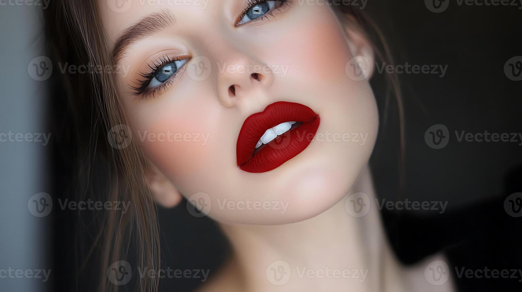 A woman with red lips and a black top photo