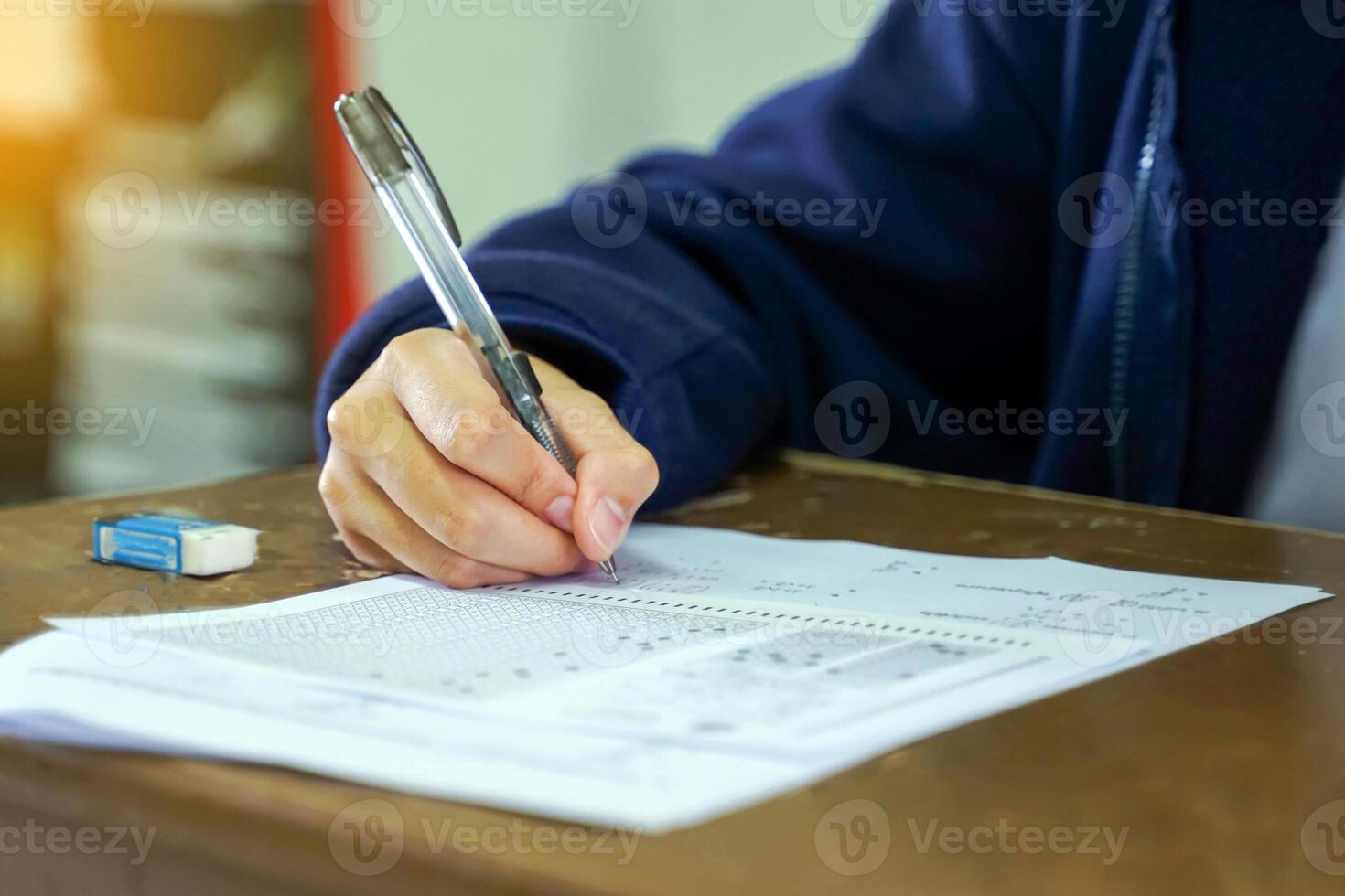 Thai students take a knowledge test to assess knowledge skills. The result of the exam will come out as a score value. Allows us to analyze the results or grade. Soft and selective focus. photo