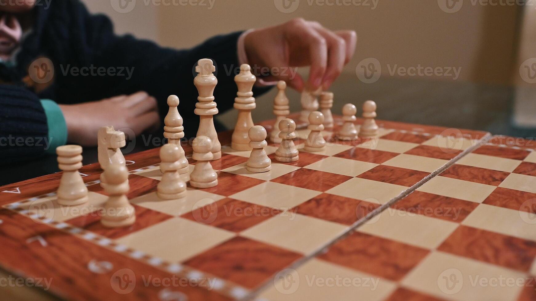 Person Strategizing a Move During an Engaging Game of Chess photo