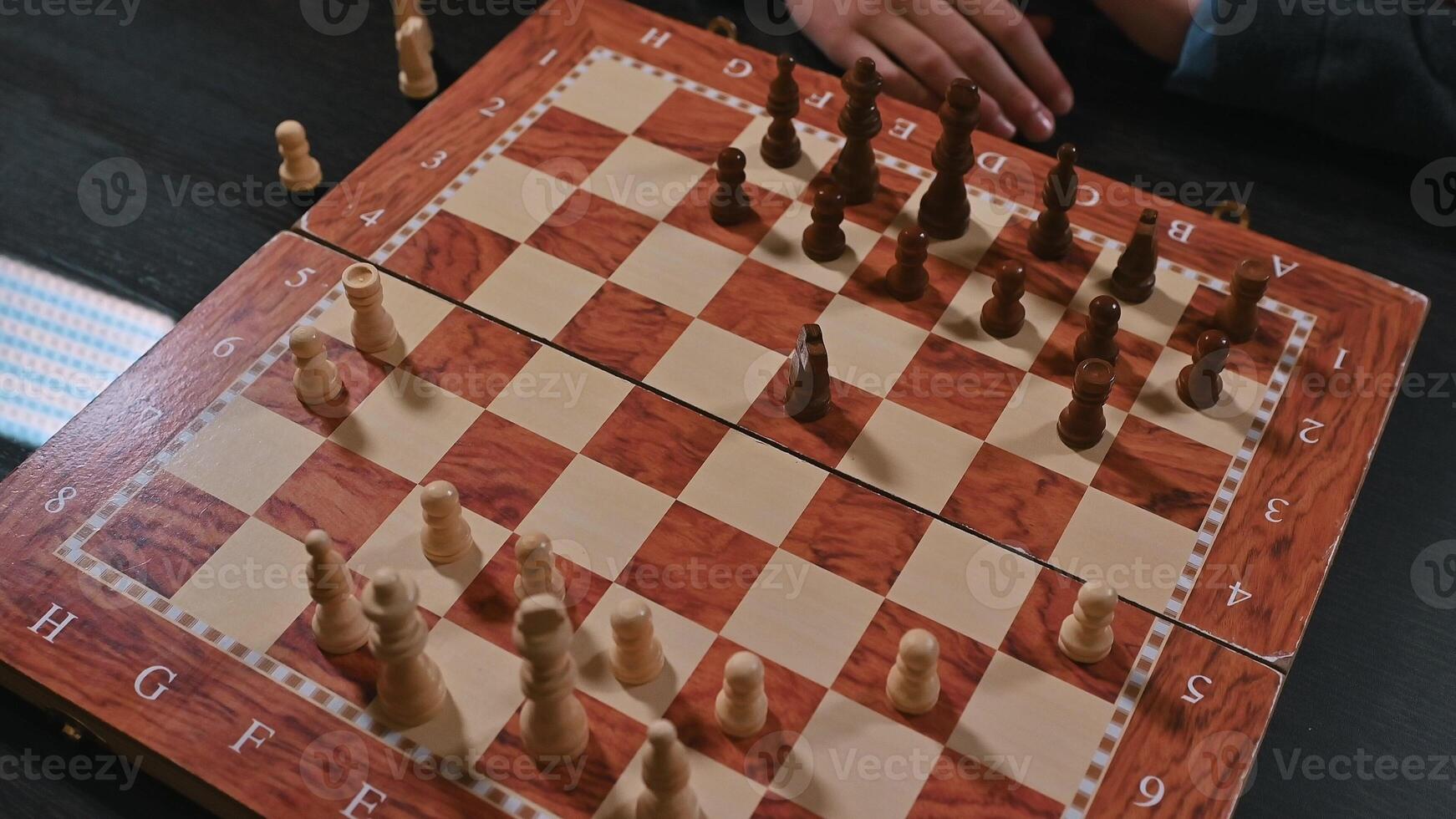 Close-up view of a chessboard with game pieces in active play photo