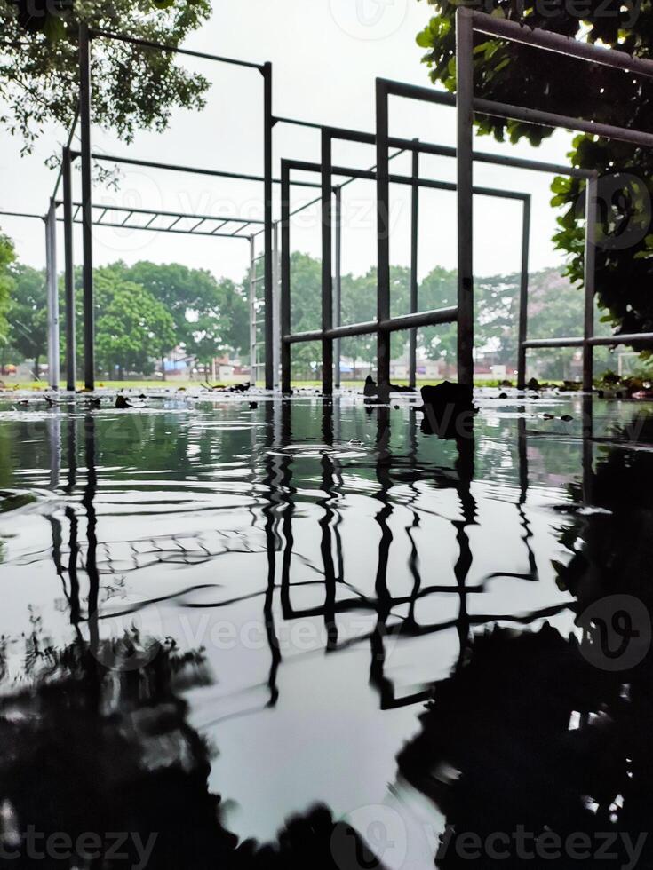 Rainy Day Reflections on Playground Equipment. photo
