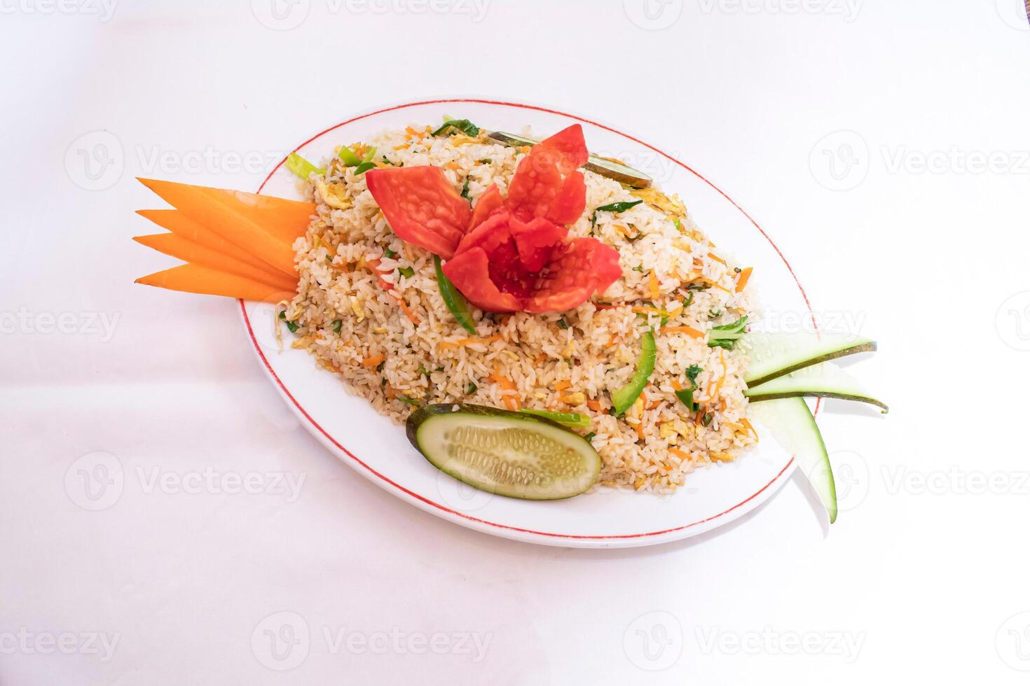 Chinese vegetable egg fried rice including carrot, cucumber tomato and capsicum served on white plate isolated on white background top view of thai and bangladeshi food photo