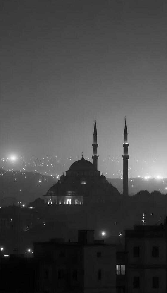 A silhouette of a Middle Eastern city skyline featuring modern domed buildings and sleek minarets against a thick foggy, gray background at night, with city lights faintly visible photo