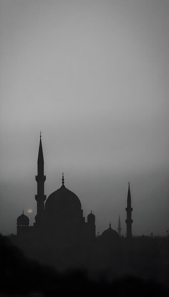 A silhouette of a Middle Eastern city skyline with intricate domed buildings and slender minarets against a foggy, gray background at dusk, with hints of orange and purple peeking through the fog 2 photo