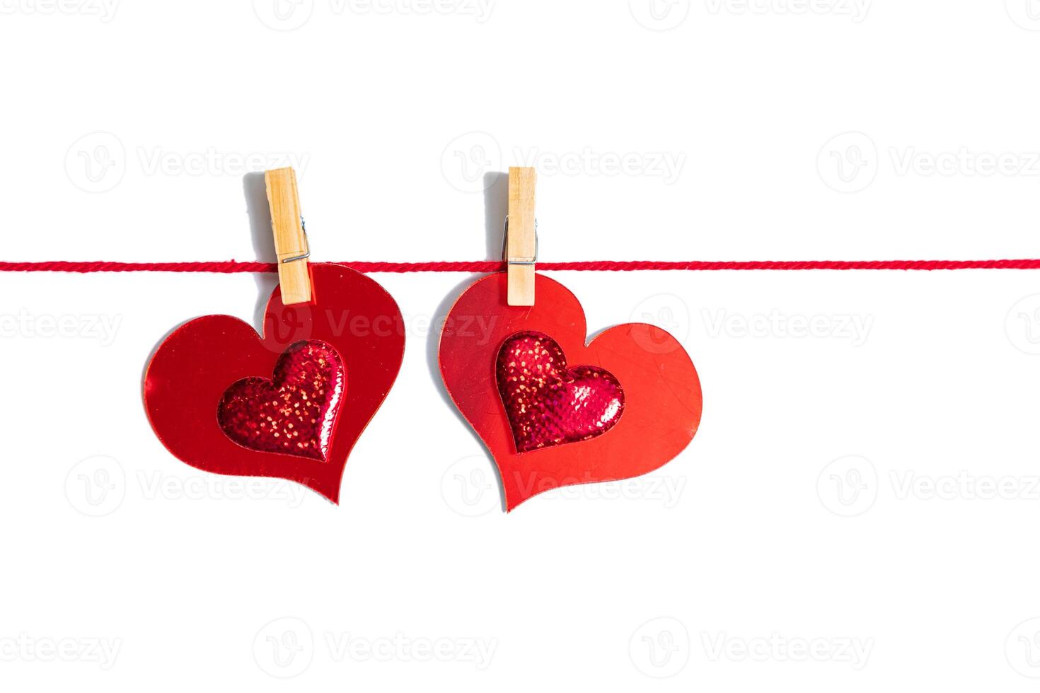 Hearts on clothespins on a rope. Sparkling red hearts background. Love banner, Valentine's day greeting card, wedding invitation, birthday poster, Happy Women's Day, Mother's Day. Photo. Copy space. photo