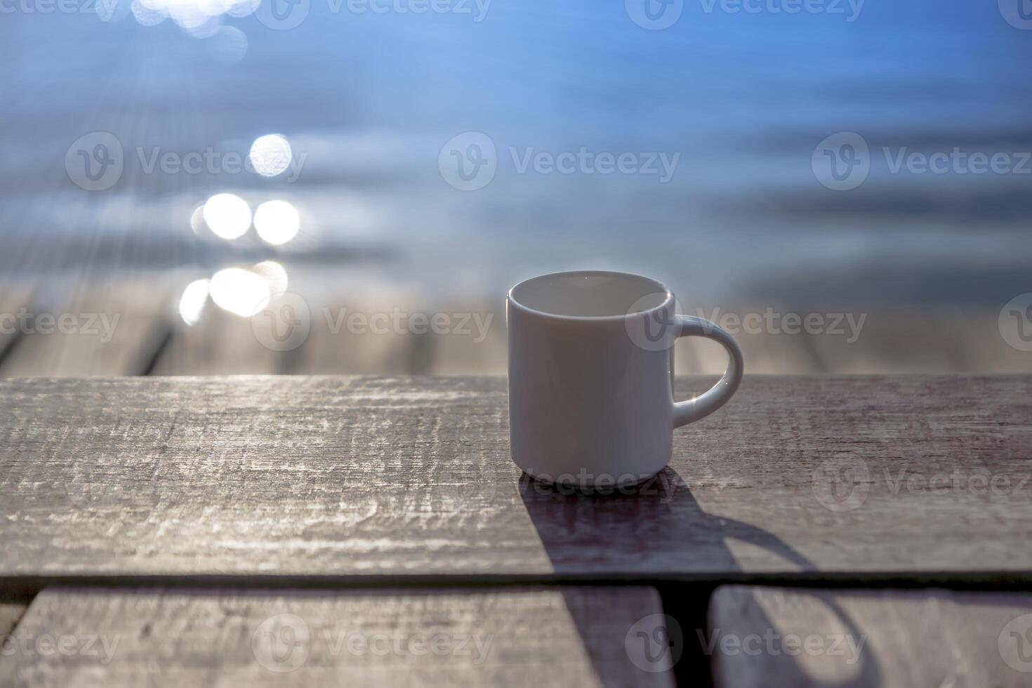 White coffee mug on wooden photo