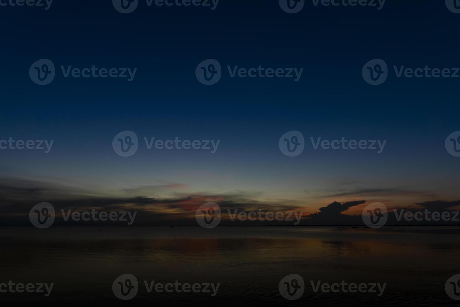 Twilight sky with star and motion water surface at the lake. photo