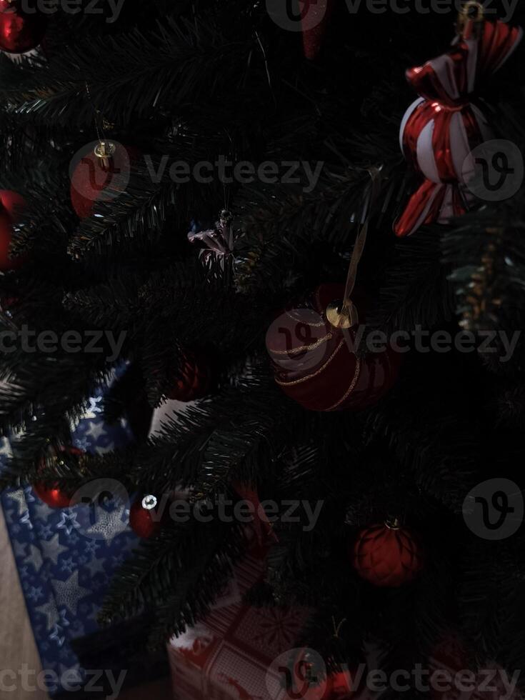 Christmas tree decorated with red and white ornaments in prague Gift boxes New Year preparation decor photo