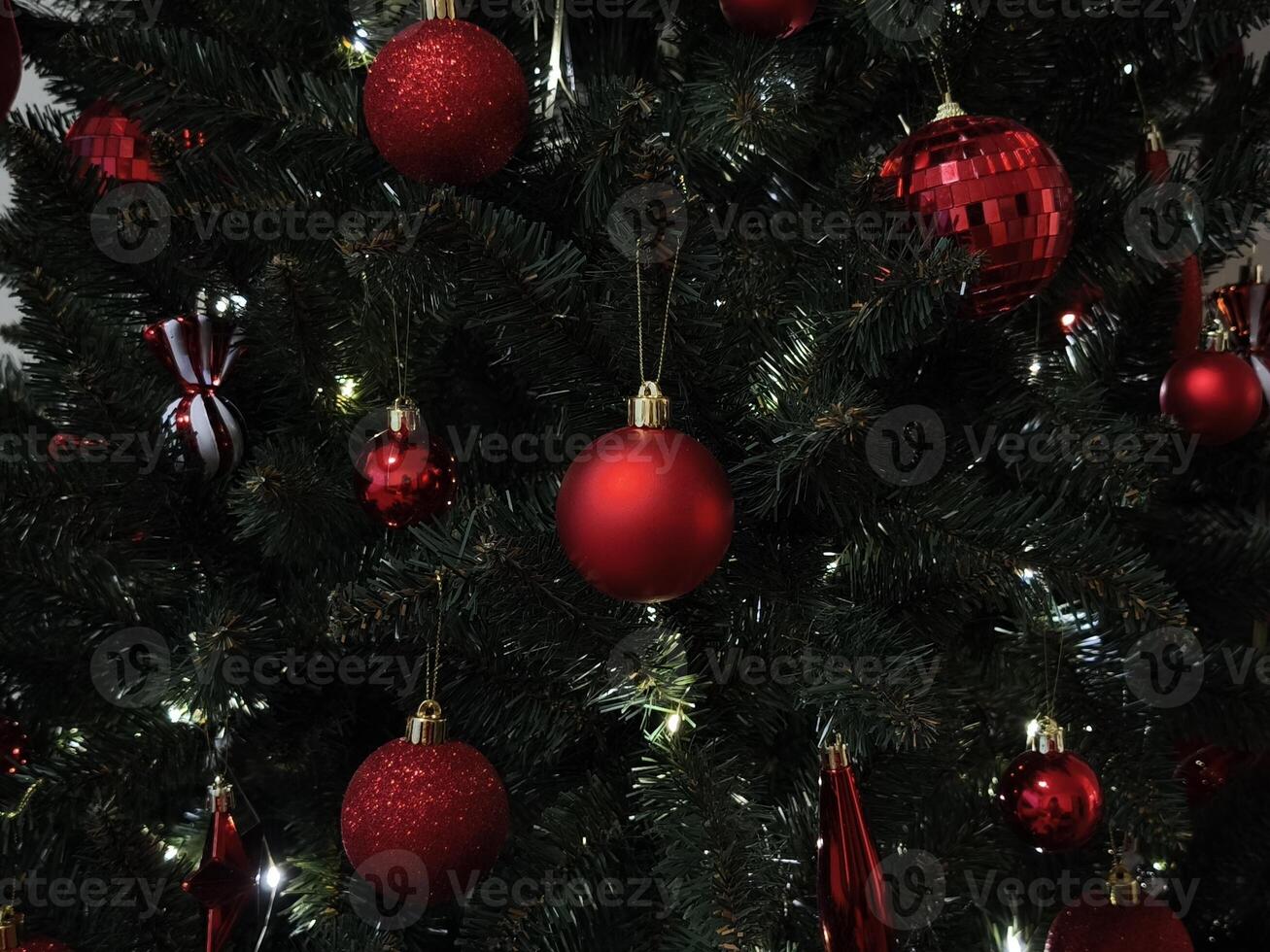 Christmas tree decorated with red and glittering ornaments in prague New Year preparation decor photo