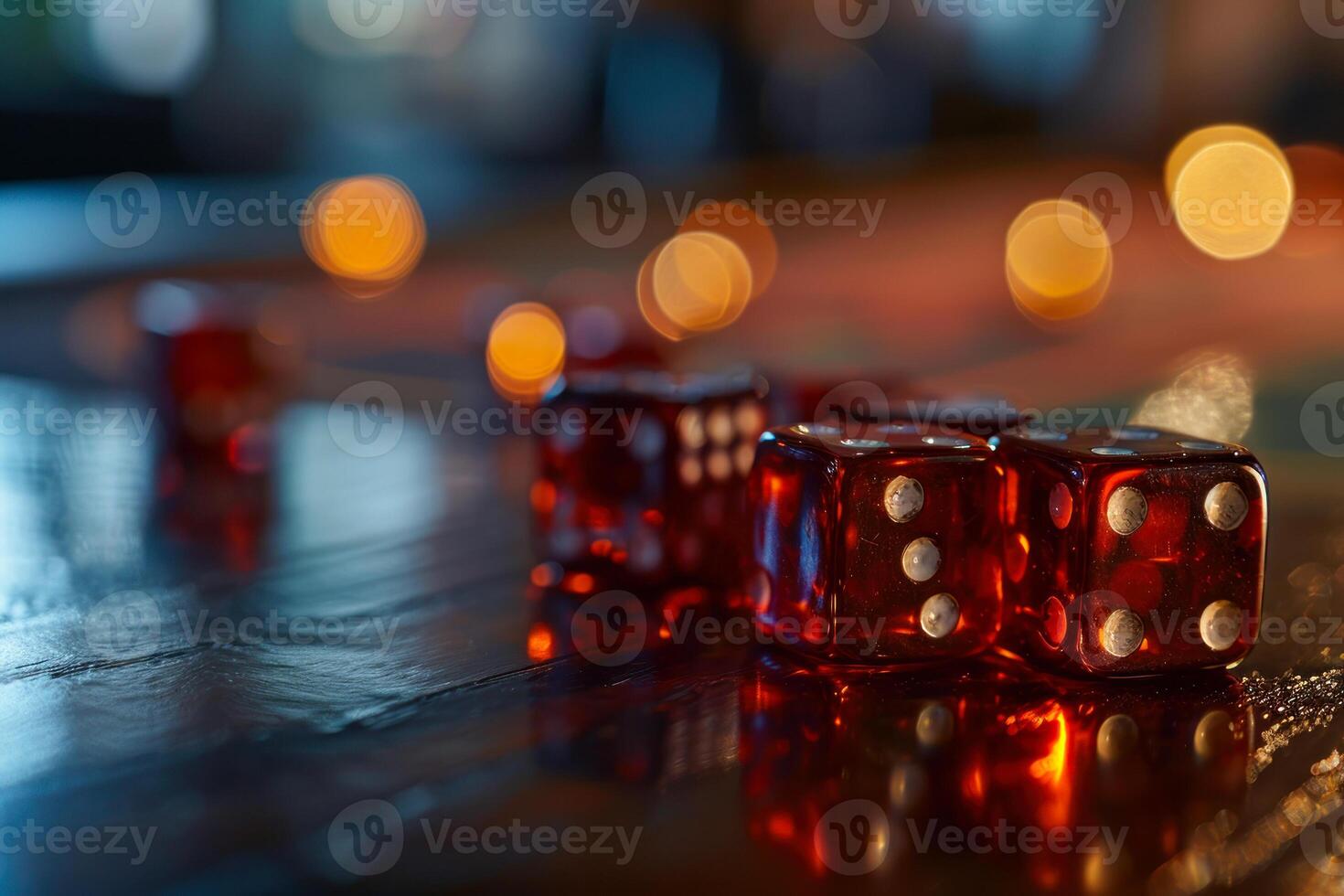 Red dice on a table with blurry lights photo