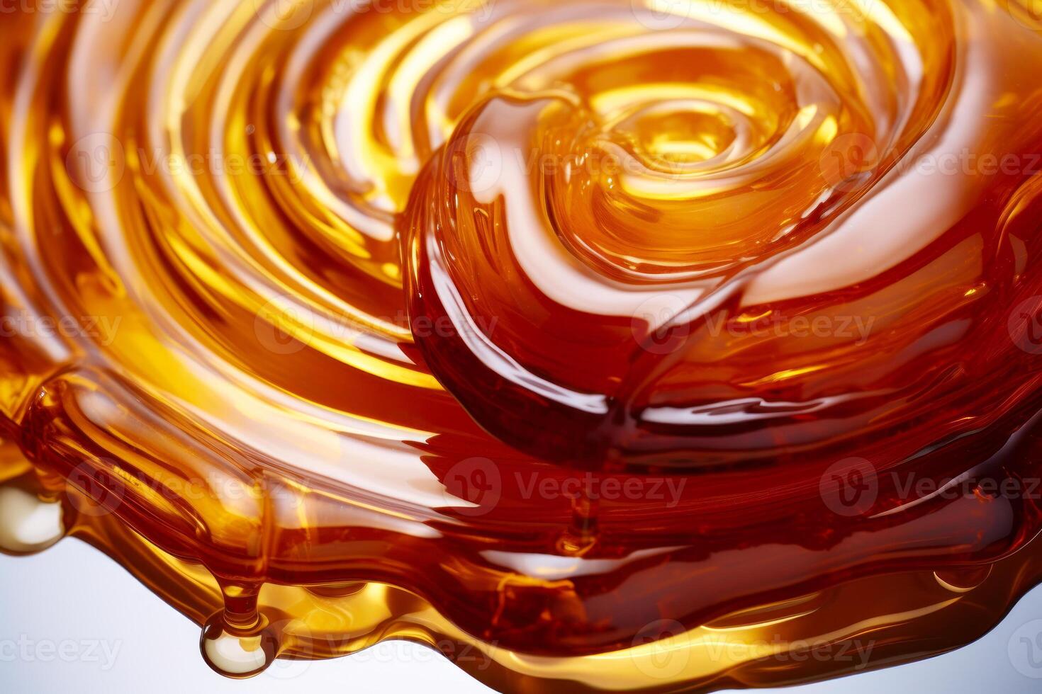 A swirl of honey on a blue background photo