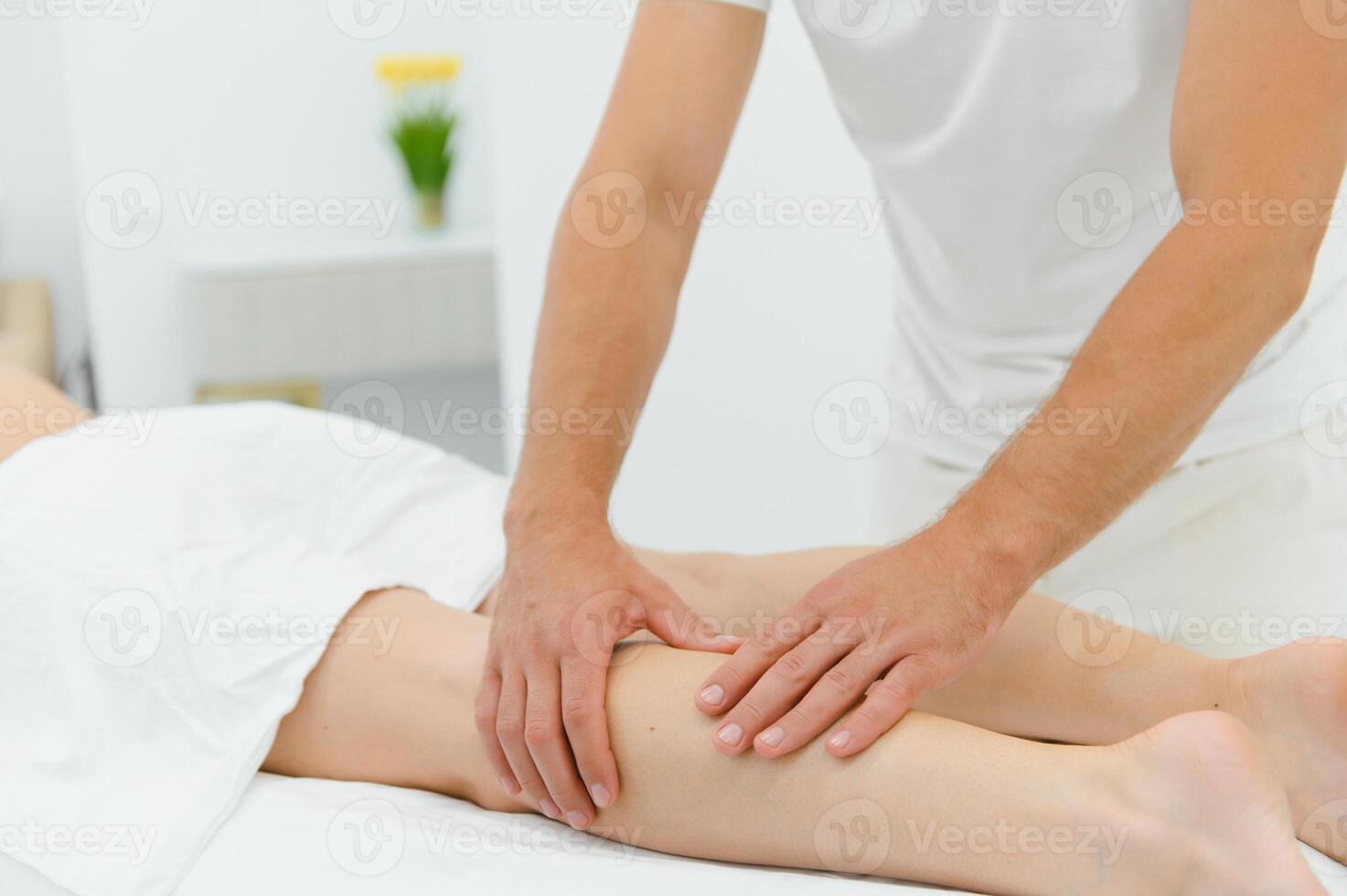 Woman getting relaxing feet massage with oils after long day photo