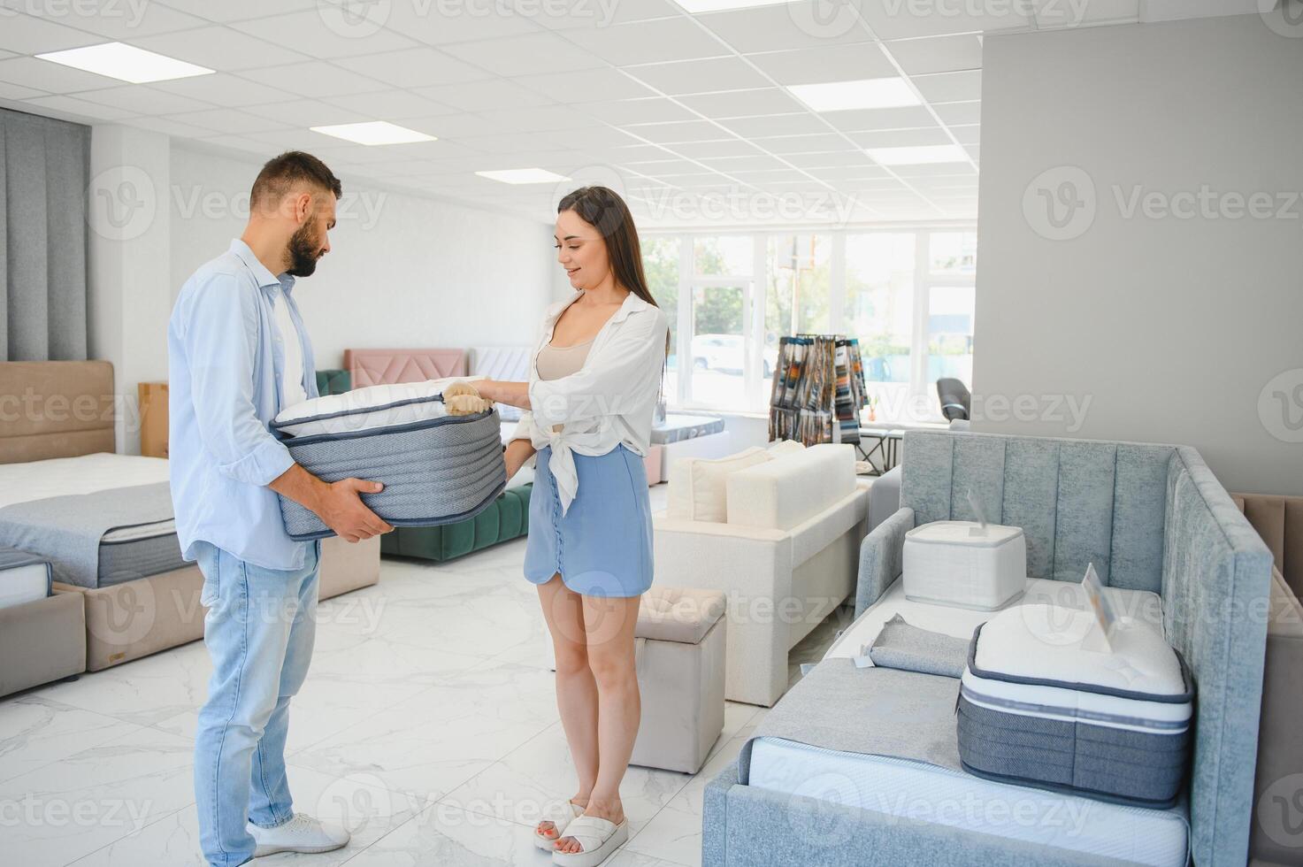 Woman with her husband at the furniture store showroom photo