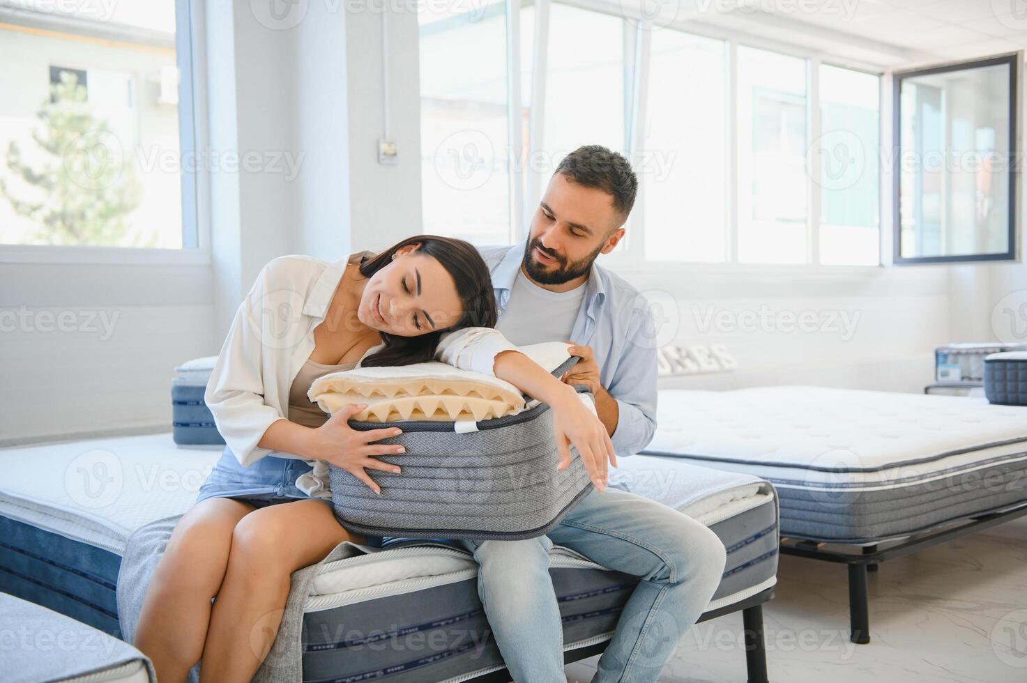 Woman with her husband at the furniture store showroom photo